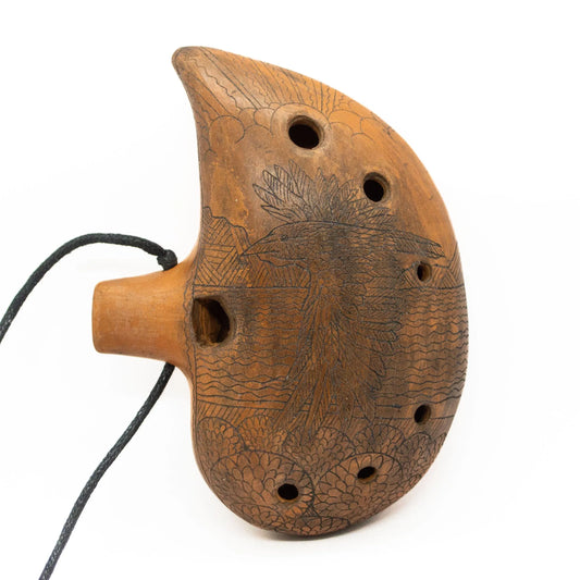 Ceramic Ocarina Journey of an Old Raven. Handmade Clay Flute with an Engraved Drawing of a Flying Raven in a Landscape.