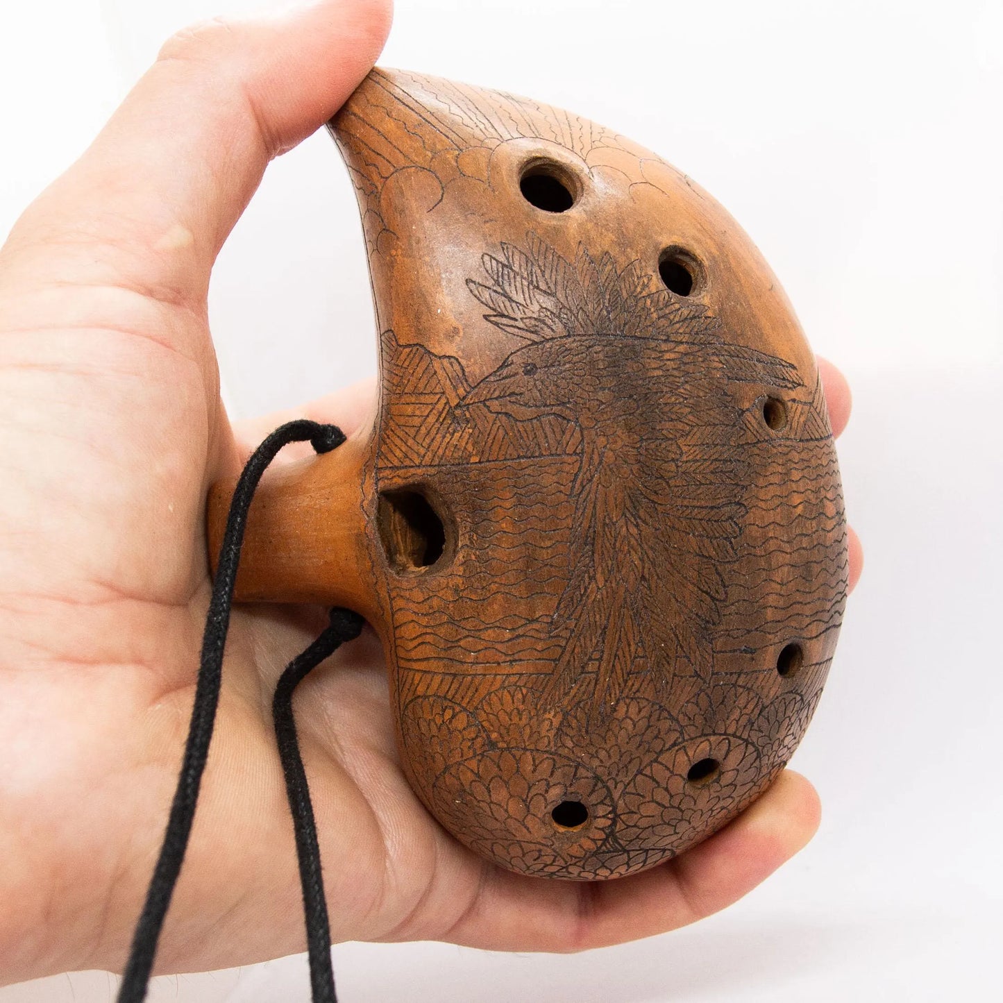 Ceramic Ocarina Journey of an Old Raven. Handmade Clay Flute with an Engraved Drawing of a Flying Raven in a Landscape.