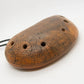 Ceramic Ocarina Journey of an Old Raven. Handmade Clay Flute with an Engraved Drawing of a Flying Raven in a Landscape.