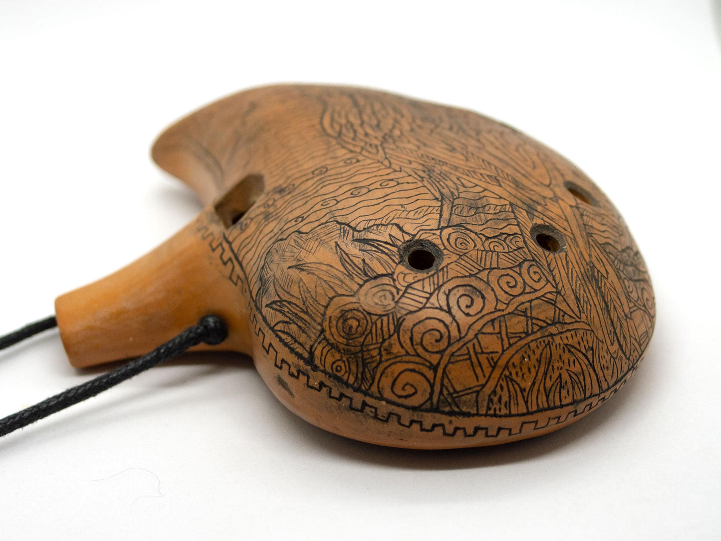Ceramic Ocarina Journey of an Old Raven. Handmade Clay Flute with an Engraved Drawing of a Flying Raven in a Landscape.