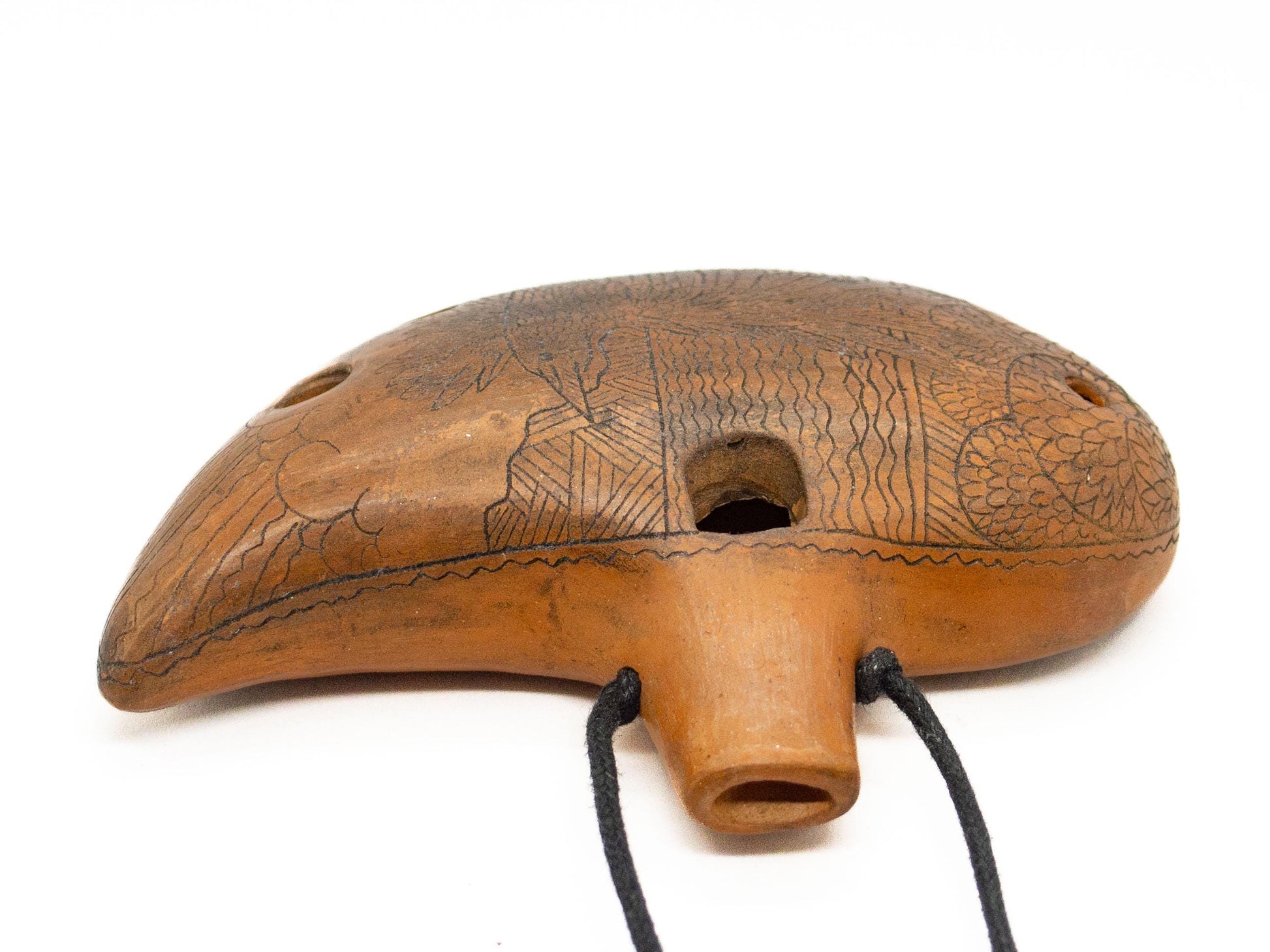 Ceramic Ocarina Journey of an Old Raven. Handmade Clay Flute with an Engraved Drawing of a Flying Raven in a Landscape.