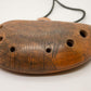 Ceramic Ocarina Journey of an Old Raven. Handmade Clay Flute with an Engraved Drawing of a Flying Raven in a Landscape.